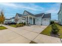 Two-car garage and attractive landscaping enhance this charming home's curb appeal at 104 True Blue, Summerville, SC 29486