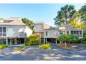Two-story townhome with light-colored siding, ample parking and landscaping at 1505 Marsh Haven, Johns Island, SC 29455