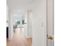 Bright hallway with light wood floors leading to a view of the living area and water at 1505 Marsh Haven, Johns Island, SC 29455