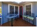 Small deck with a bistro table and chairs, perfect for relaxing at 3131 Palmetto Blvd, Edisto Island, SC 29438