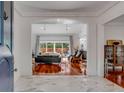 Bright entryway with marble floors and view into the living room at 371 Live Palmetto Bluff, Mount Pleasant, SC 29464