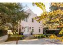 Two-story house with white door, landscaping, and brick driveway at 429 Venning St, Mount Pleasant, SC 29464