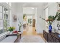 Bright foyer with hardwood floors, bench, and view to living area at 429 Venning St, Mount Pleasant, SC 29464