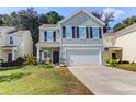 Two-story house with gray siding, black shutters, and a two-car garage at 1421 Oldenburg Dr, Mount Pleasant, SC 29429