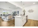 Modern kitchen with white cabinets, stainless steel appliances and an island at 177 Surfbird Rd # 510, Summerville, SC 29486