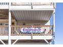 Deck with railing and Edisto Pia sign at 3611 Yacht Club Rd # B, Edisto Island, SC 29438