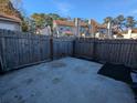 Small, fenced backyard with a concrete patio at 403 Reserve Way, Summerville, SC 29485