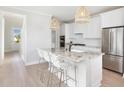 White shaker cabinets, granite countertops, and stainless steel appliances at 746 Blue Iris Way, Summerville, SC 29486