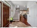 Bright entryway with hardwood floors, staircase, and view to living room at 780 Post Oak Dr, Mount Pleasant, SC 29464