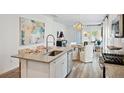 Modern kitchen with island, stainless steel appliances, and ample counter space at 1018 Currant Rd, Summerville, SC 29485