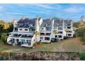 Aerial view of upscale condos with lush landscaping and water access at 150 Wappoo Creek Dr # 15, Charleston, SC 29412