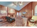 Spacious living room with vaulted ceiling, wood paneling, and fireplace at 185 Old Fort Dr, Ladson, SC 29456
