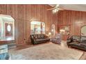 Open living area with wood paneling, hardwood floors, and ample natural light at 185 Old Fort Dr, Ladson, SC 29456