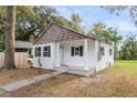 Recently remodeled white cottage featuring a covered porch at 1979 Macon Ave, North Charleston, SC 29405