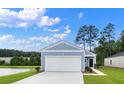 Newly built light blue one-story home with a two-car garage at 502 Frutchey Ct, Summerville, SC 29486