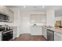 Modern kitchen with stainless steel appliances and granite countertops at 114 Lilac Grove Way, Summerville, SC 29486