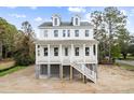 Two-story home with white siding, gray roof, and a front porch at 1577 Periwinkle Dr, Mount Pleasant, SC 29466