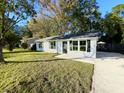 Newly renovated home showcasing a clean, modern exterior and landscaping at 413 Madeline Dr, Goose Creek, SC 29445