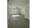 Bright and spacious living area with wood-look floors and shiplap accent wall at 413 Madeline Dr, Goose Creek, SC 29445