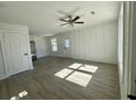 Open concept living space featuring luxury vinyl plank flooring and neutral tones at 413 Madeline Dr, Goose Creek, SC 29445