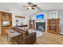 Spacious living room with a fireplace, hardwood floors, and built-in shelving at 104 Tanager St, Summerville, SC 29483