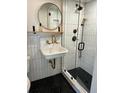 Modern bathroom with hexagon tile floor, walk-in shower, and a vintage-style sink at 106 Sparrow Dr, Isle of Palms, SC 29451