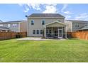 Spacious backyard with screened porch, patio, and fenced yard at 192 Lindera Preserve Blvd, Summerville, SC 29486