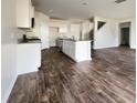Open concept kitchen with white cabinets, granite countertops, and stainless steel appliances at 410 Cedarview Rd, Summerville, SC 29486