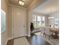 Elegant dining room with hardwood floors and a view to the backyard at 149 Winding Grove Ln, Moncks Corner, SC 29461