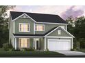 Two-story green house with white trim and a two-car garage at 149 Winding Grove Ln, Moncks Corner, SC 29461