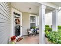 Front door entry with a glass door and seasonal decor at 223 Laurel Crest Way, Summerville, SC 29486