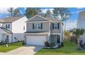 Two-story house, gray siding, white garage door, and small front yard at 314 Black Birch Dr, Summerville, SC 29486