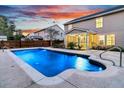 Inviting backyard pool with a concrete deck and screened porch at 319 Deep River Rd, Summerville, SC 29486