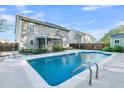 Refreshing blue swimming pool in a sunny backyard setting at 319 Deep River Rd, Summerville, SC 29486