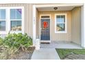 Inviting front porch with a navy blue door and landscaping at 7833 Montview Rd, North Charleston, SC 29418