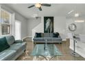 Spacious living room featuring a gray sofa and a glass coffee table at 7833 Montview Rd, North Charleston, SC 29418