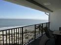 Relaxing balcony overlooking the ocean and sandy beach at 9002 Palmetto (1/13 Share) Dr # 517, Isle of Palms, SC 29451