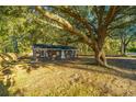 Brick ranch house nestled under a large oak tree, with a fenced yard at 110 Edgebrook Dr # 28, Summerville, SC 29486