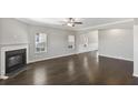 Spacious living room with dark hardwood floors and a fireplace at 114 Crosscut Ln, Summerville, SC 29486