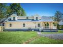 Rear view of remodeled home with large yard and patio at 118 Carter, Walterboro, SC 29488