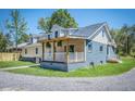 Side view of blue and beige home with covered porch at 118 Carter, Walterboro, SC 29488