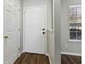 Bright entryway with hardwood floors and white doors at 1370 Pinnacle Rd, Charleston, SC 29412