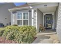 Front entrance with black door and lush shrubs at 534 Four Seasons Blvd, Summerville, SC 29486