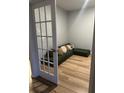 Finished basement room with sectional sofa and wood flooring at 1011 Mossy Rock Dr, Summerville, SC 29485