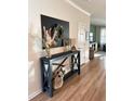 Entryway with console table, decor, and view to living area at 1011 Mossy Rock Dr, Summerville, SC 29485