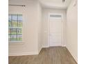 Bright entryway with wood-look floors, and neutral walls at 113 Corvus St, Summerville, SC 29483