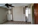 Empty bedroom with wood paneling and tile floor at 153 Davis Ter, Saint George, SC 29477