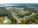 Aerial view of a new home community with houses, ponds, and marsh at 1726 Cultivation Ln # 534, Mount Pleasant, SC 29466