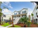 Two-story white house with a large front porch and landscaping at 1726 Cultivation Ln # 534, Mount Pleasant, SC 29466