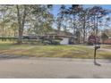 House exterior showcasing a brick facade and attached garage at 300 Grouse Rd, Summerville, SC 29485